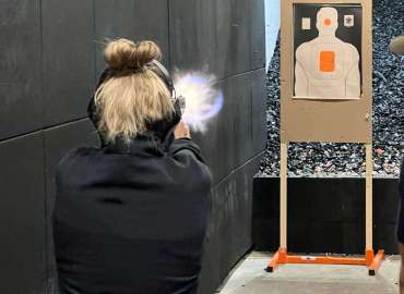 Defensive Firearms Training US Range Pistol at Range Woman Shooting